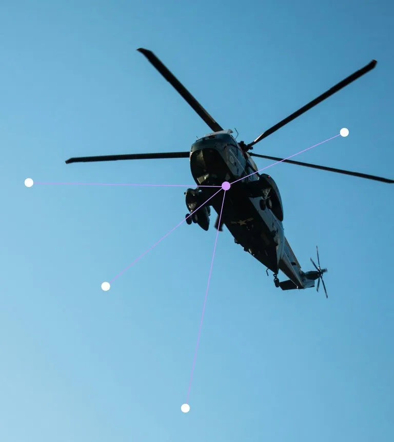 Military helicopter in flight against a blue sky